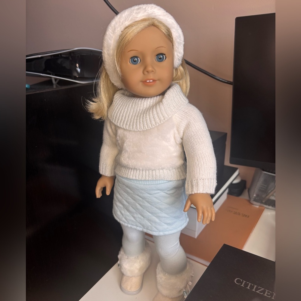 American Girl doll wearing purple PJ. Truly me #22.